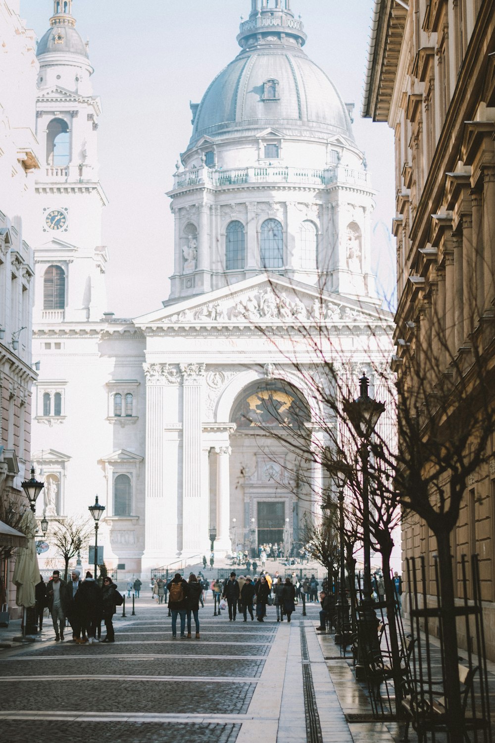 people walking in front of cathedral