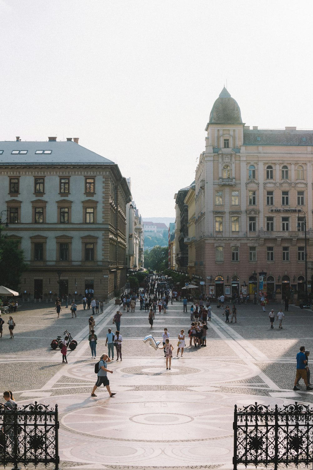 people walking on street surrounding of building