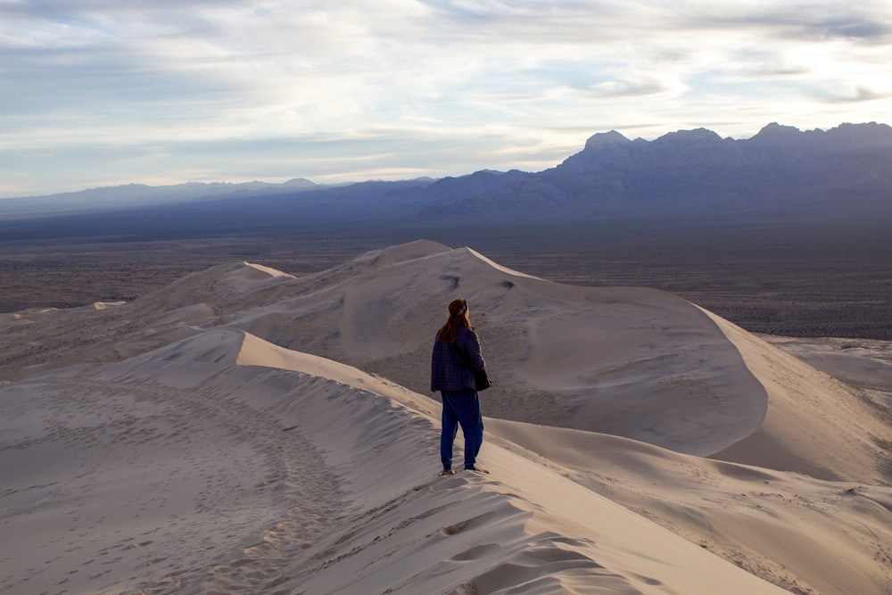 person standing on desert