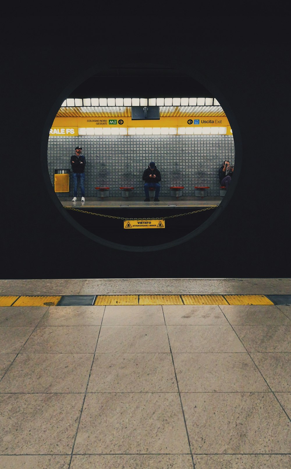 man sitting near man standing