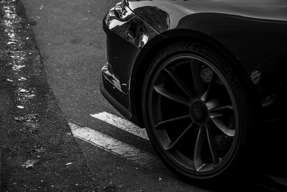 a black sports car parked on the side of the road