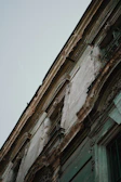 Close-up of a detailed property inspection focusing on the building facade