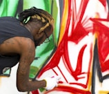 man painting on wall