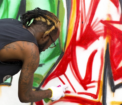 man painting on wall