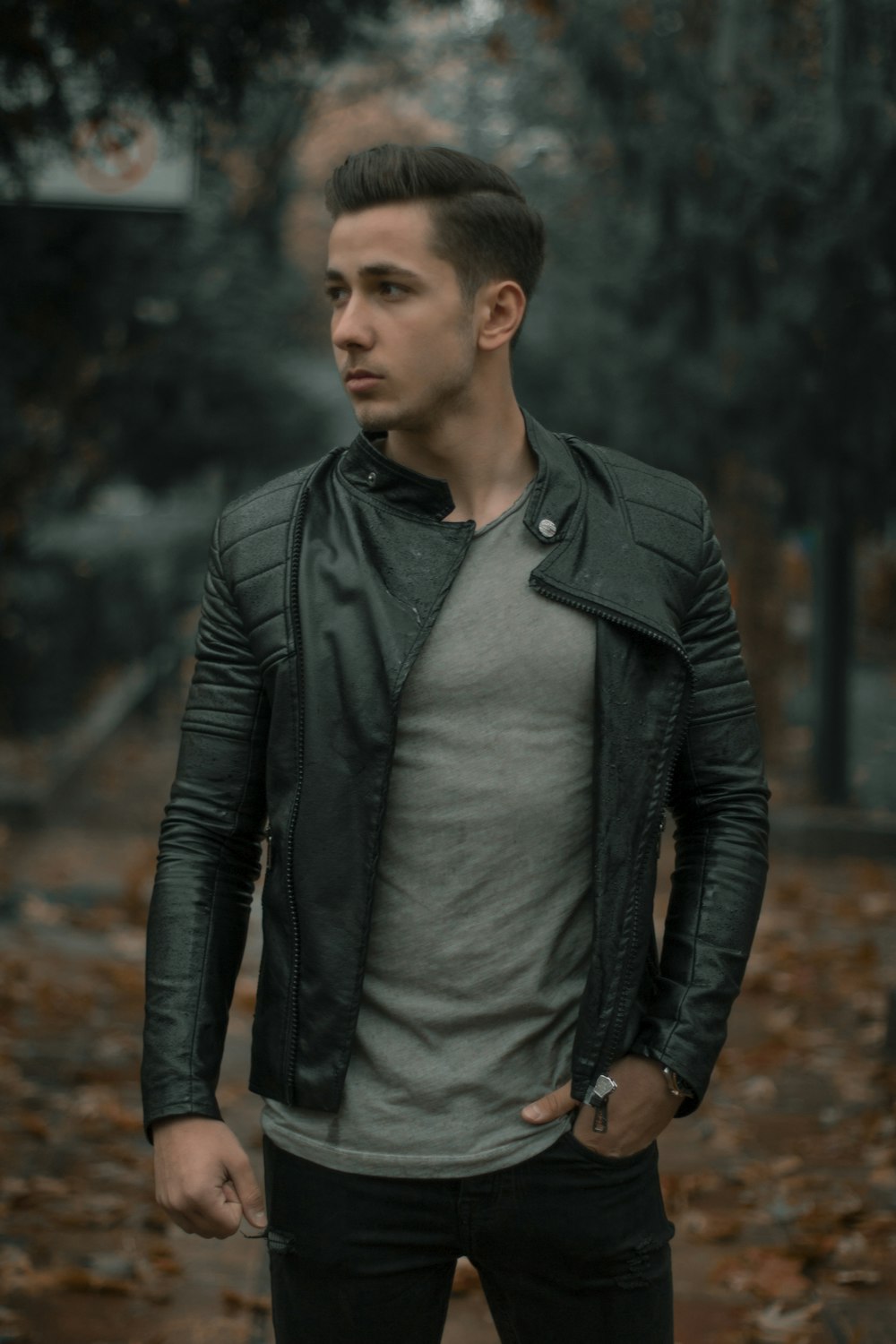 man wearing black full-zip leather jacket photo