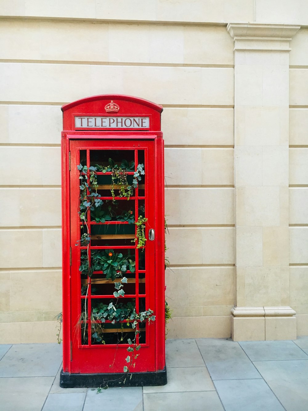 red telephone booth plat box
