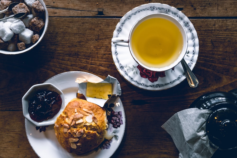 tea and bread on top of plate