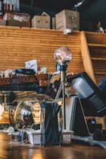 Various used car accessories displayed on a wooden counter with natural light.