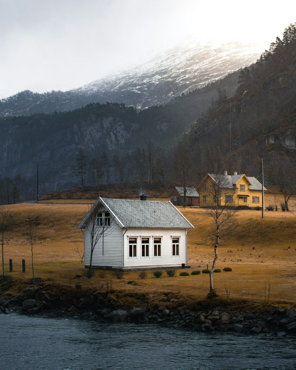 white and gray house with a view of white mountain