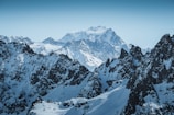 Majestic snowy peaks of the Swiss Alps under a clear blue sky.