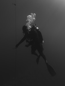 person under water with snorkling equipment