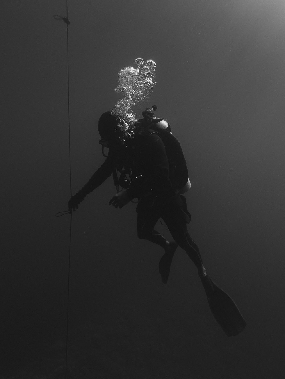 person under water with snorkling equipment