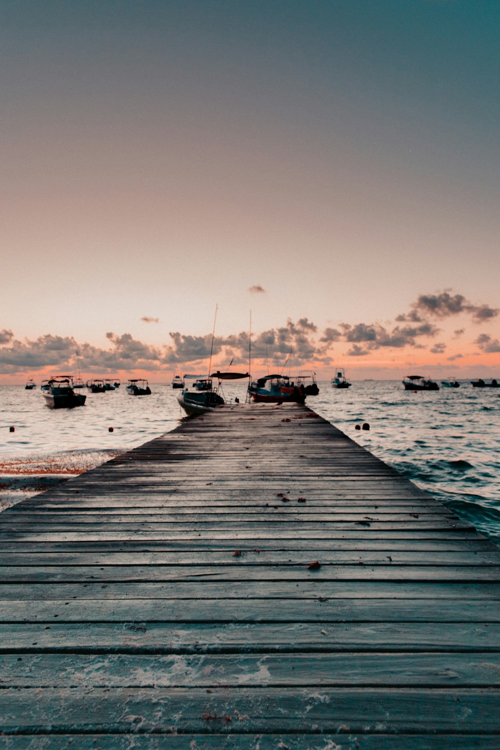 brown wooden dock under blue sky during daytime