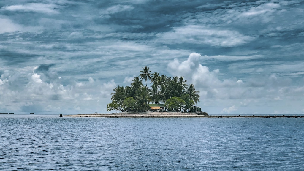 photography of island against sky