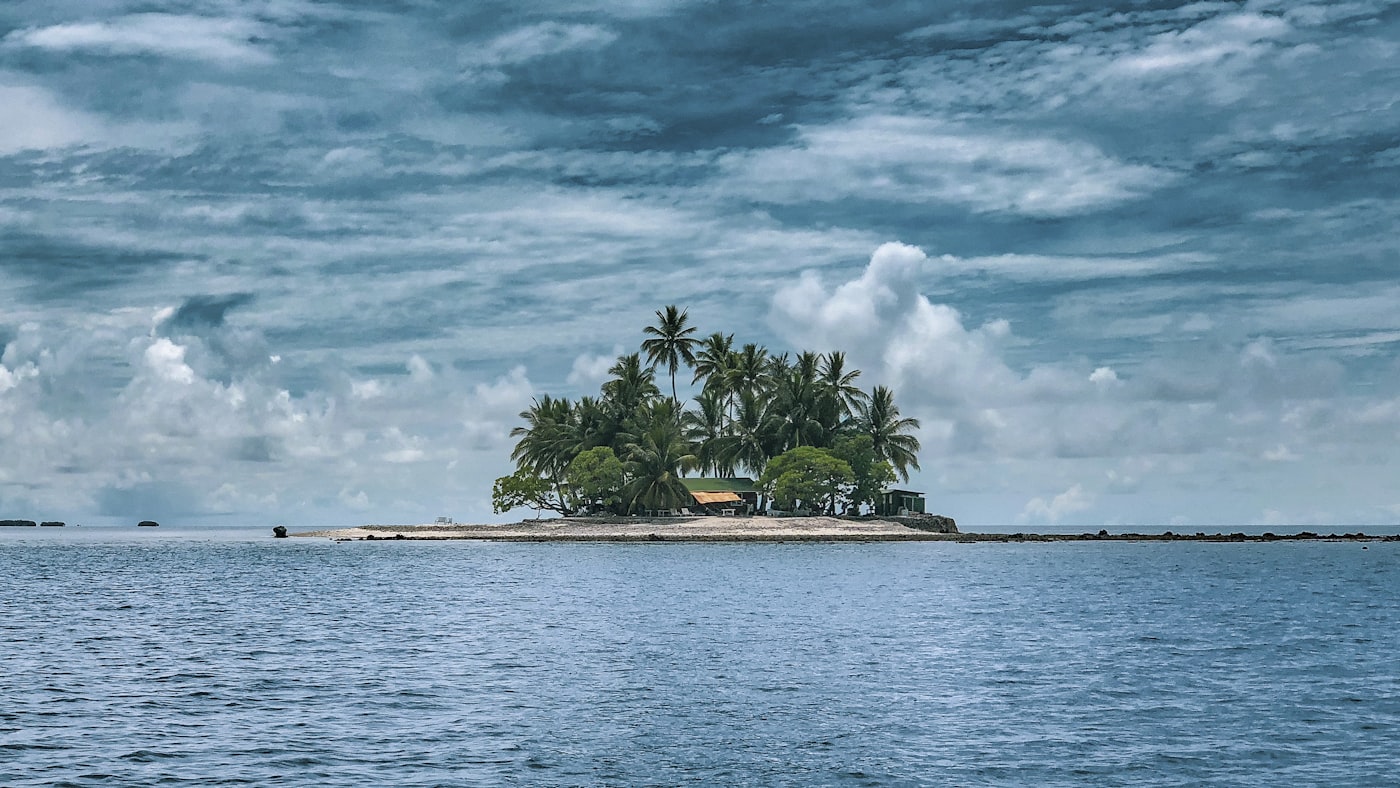 A stunning view of a Micronesian lagoon with crystal clear water and lush green islands