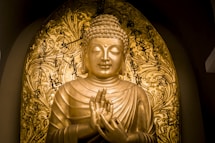 gold-colored Buddha statue
