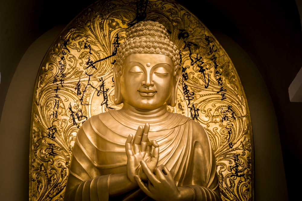 gold-colored Buddha statue