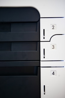 a close up of a white and black wall with numbers