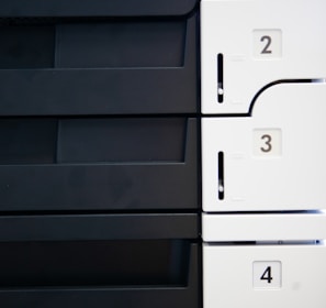 a close up of a white and black wall with numbers