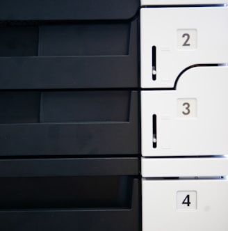 a close up of a white and black wall with numbers