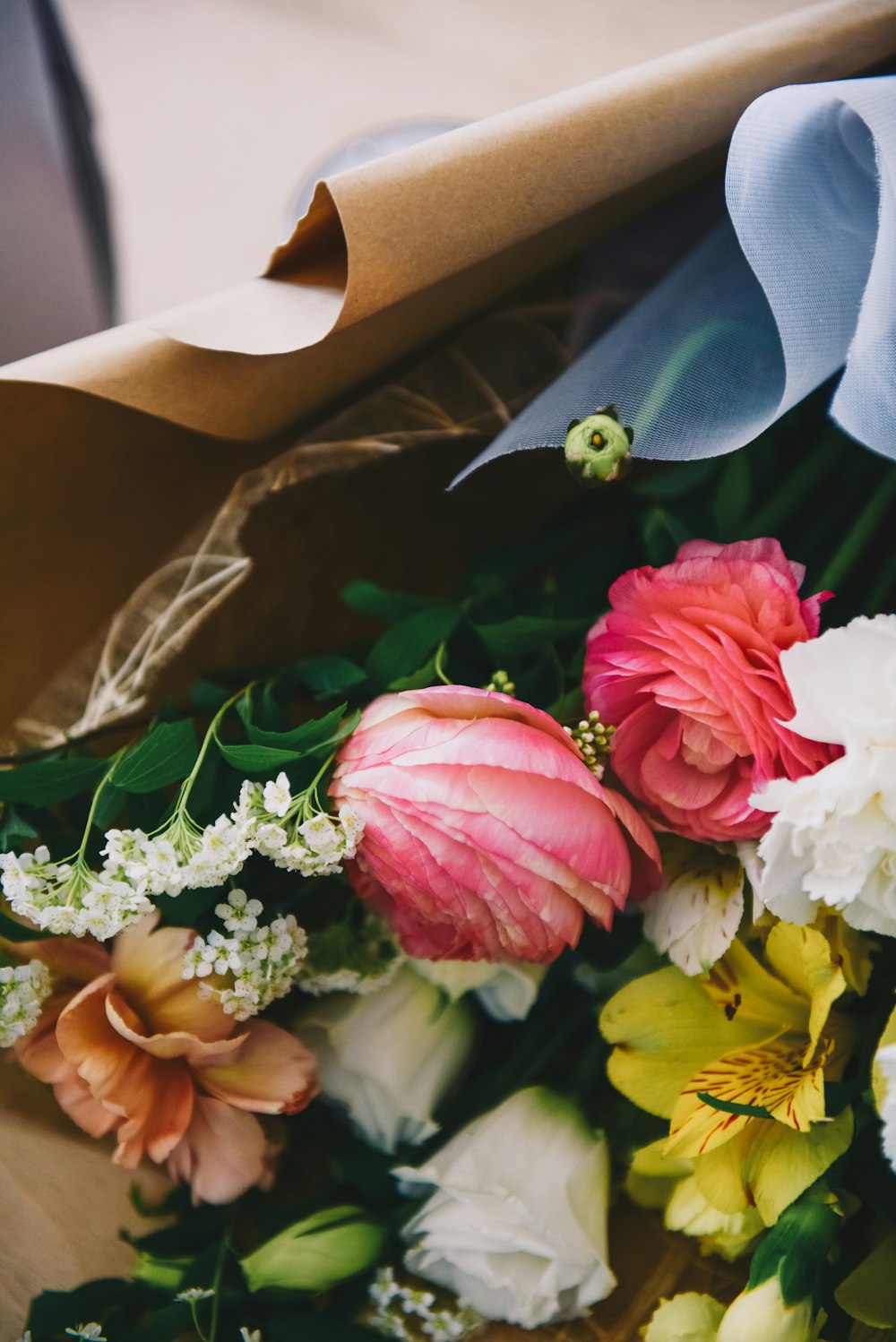 flower bouquet inside paper bag