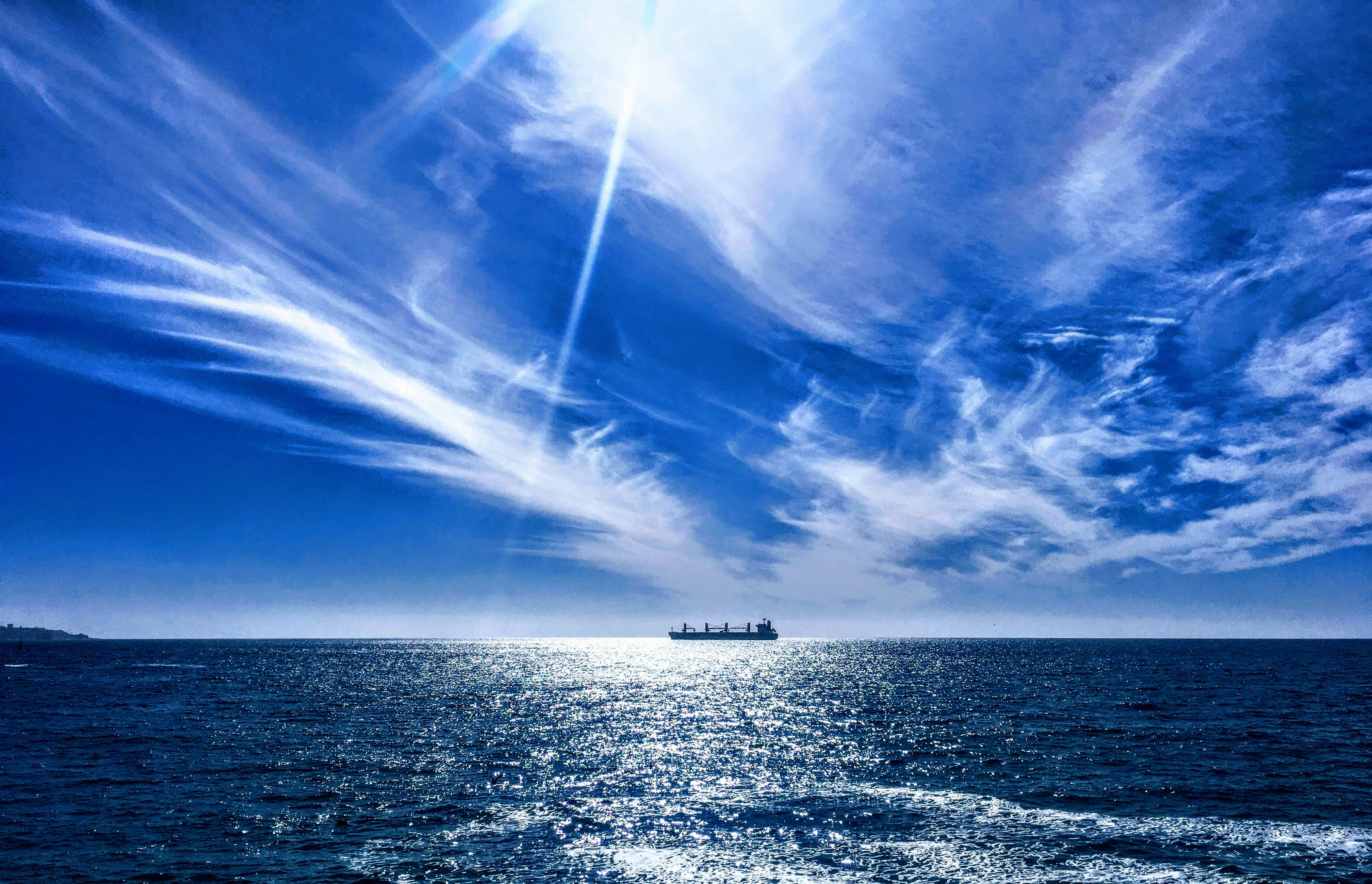boat on ocean during daytime