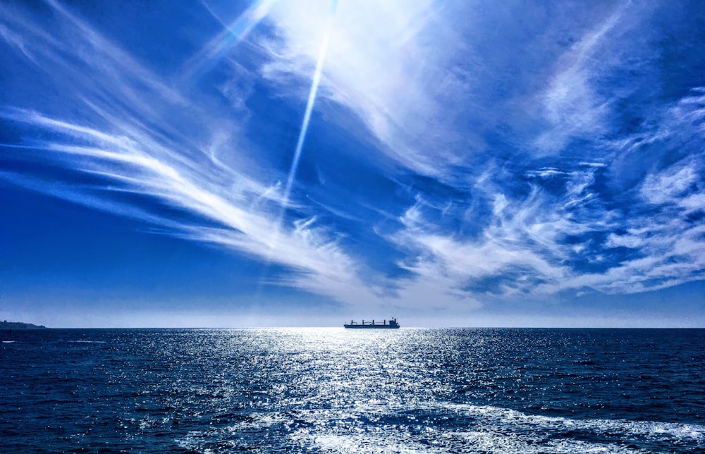 boat on ocean during daytime