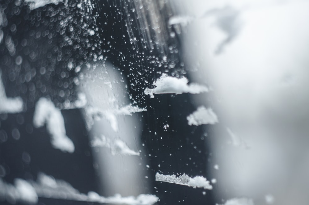 a close up of a window with rain drops