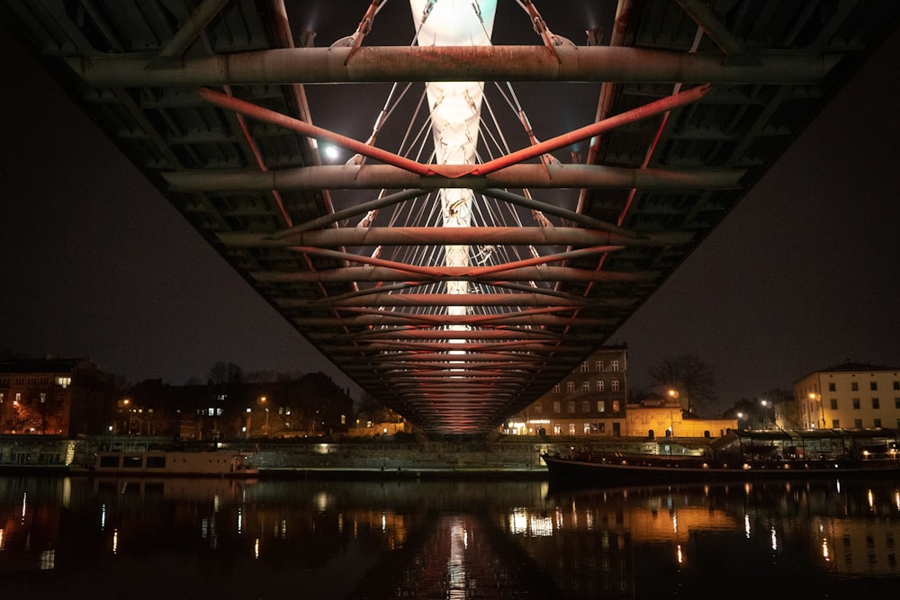 a view of a bridge that is lit up at night