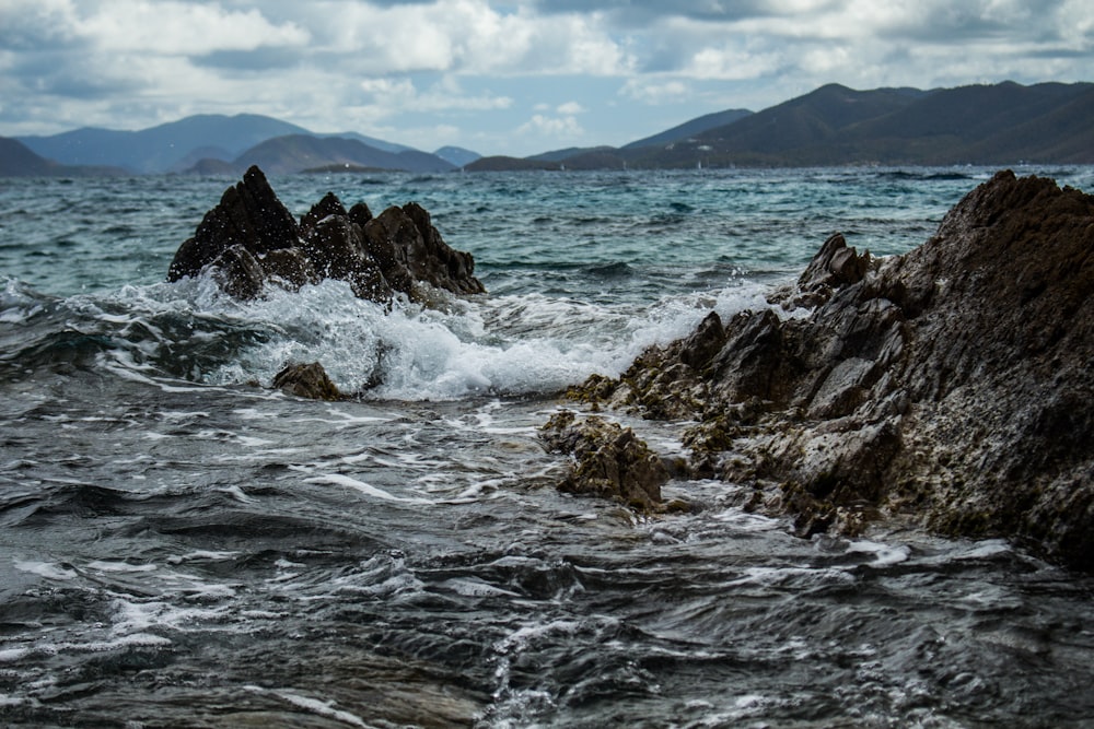 gray rocks on body of water