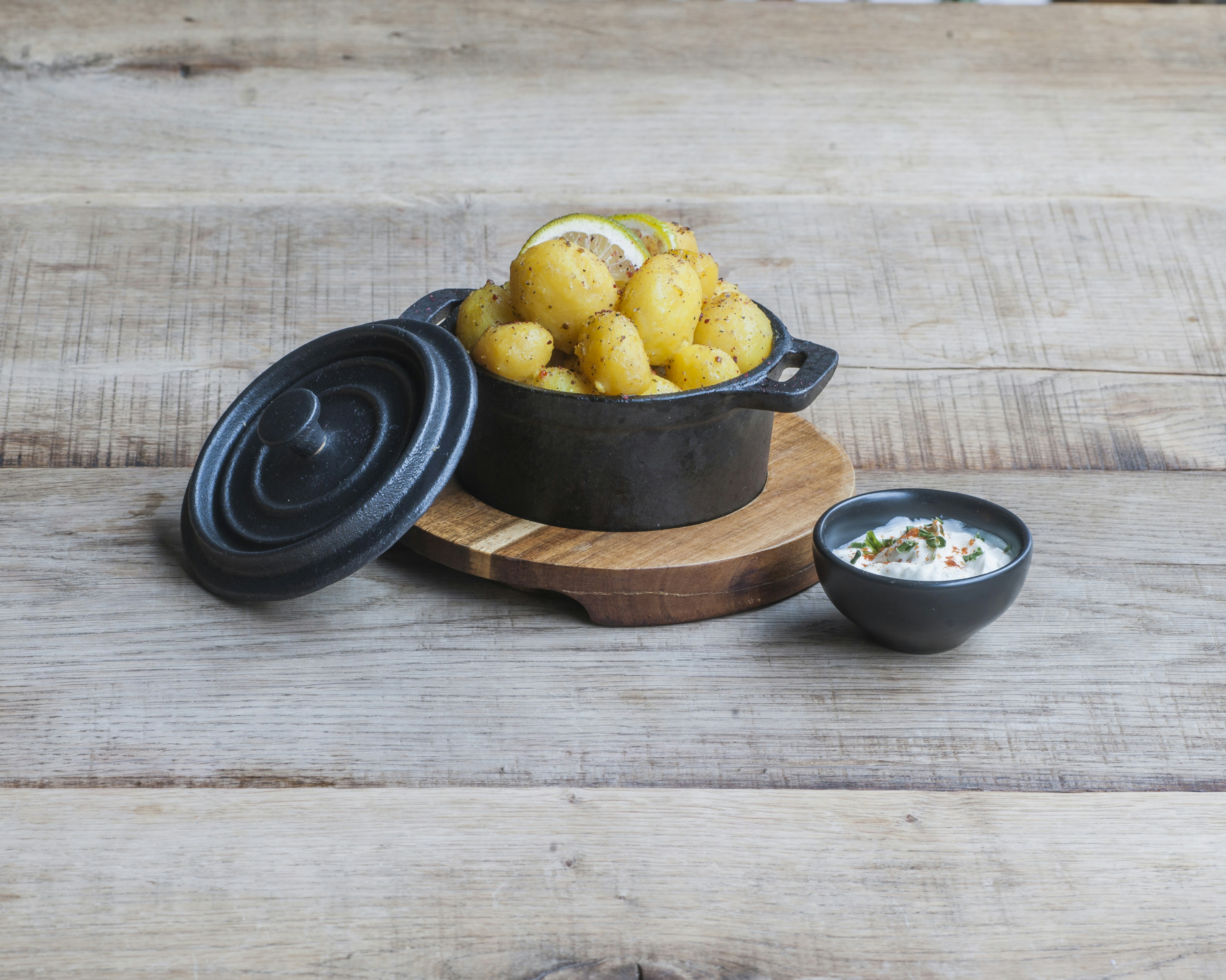 cooked potatoes in dutch oven beside soup