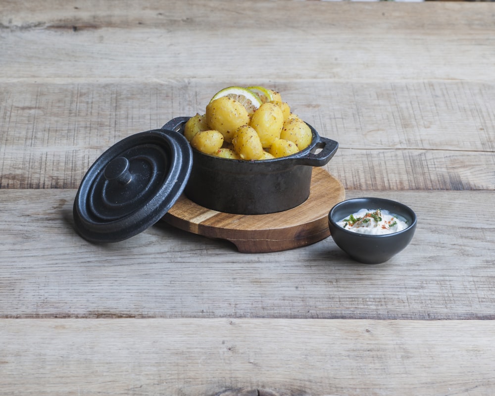 cooked potatoes in dutch oven beside soup