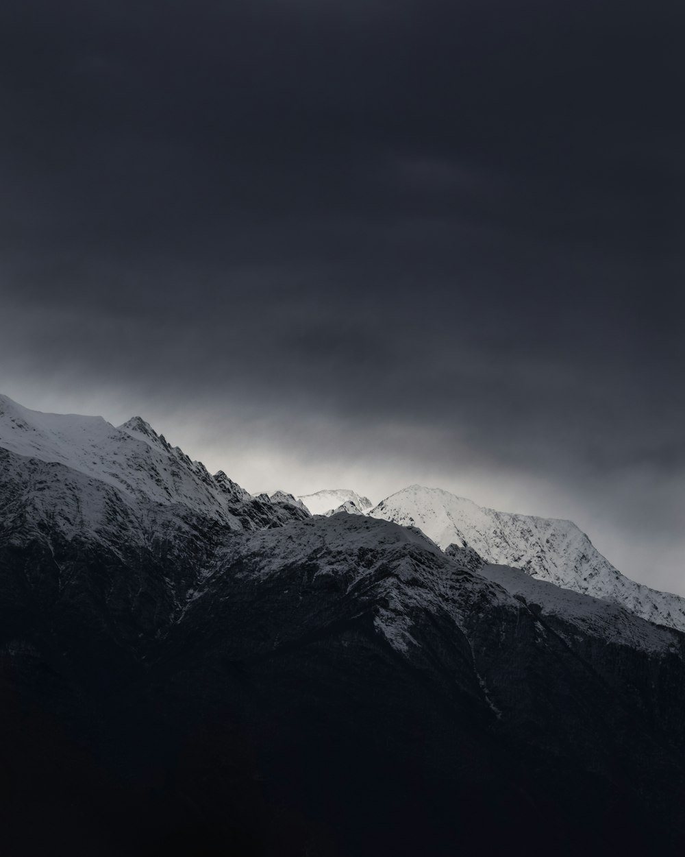 snow capped mountain under cloudy sky during daytime