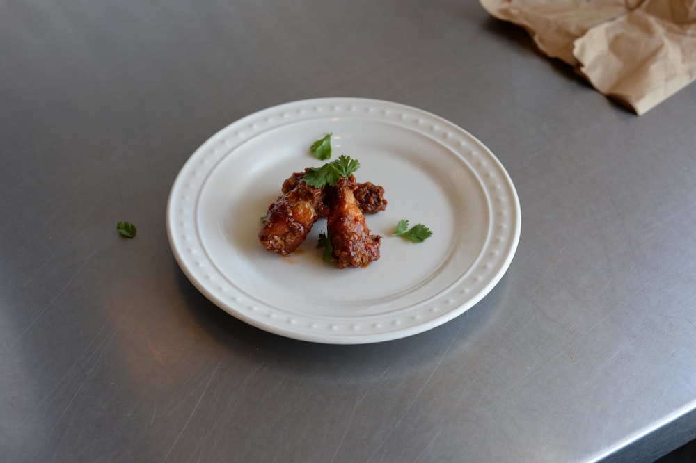 cooked dish on white ceramic plate