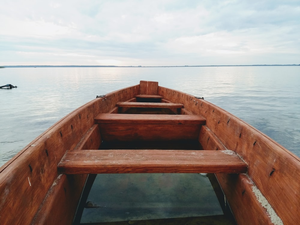 closeup photo of canoe on body of water during daytime