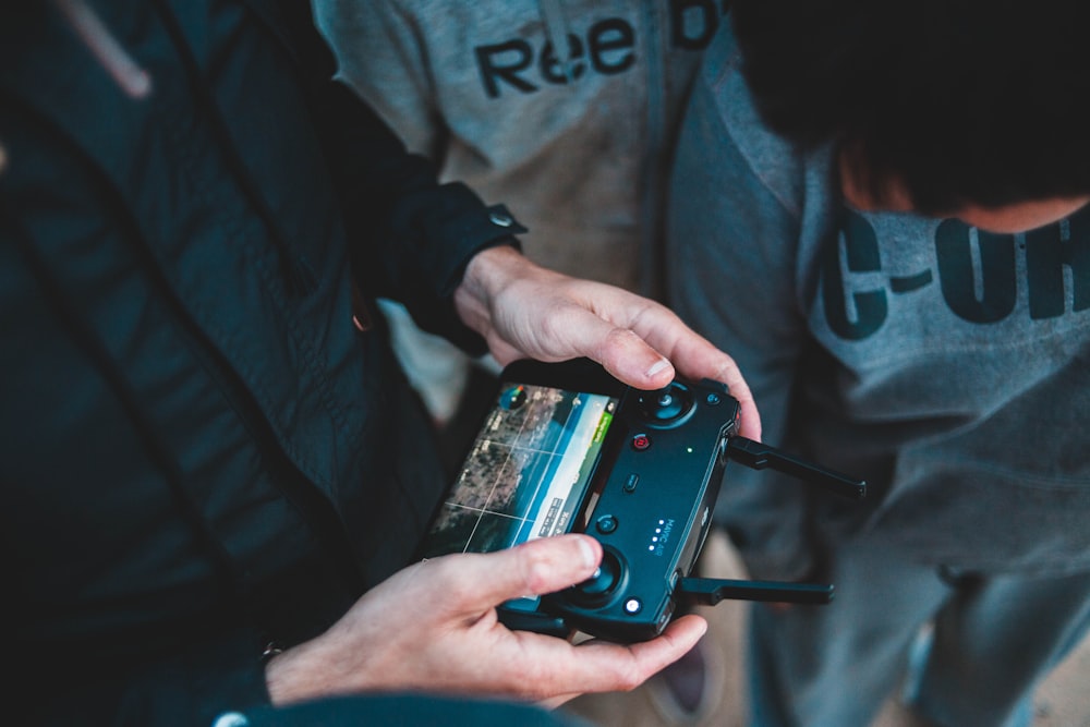 person holding digital controller