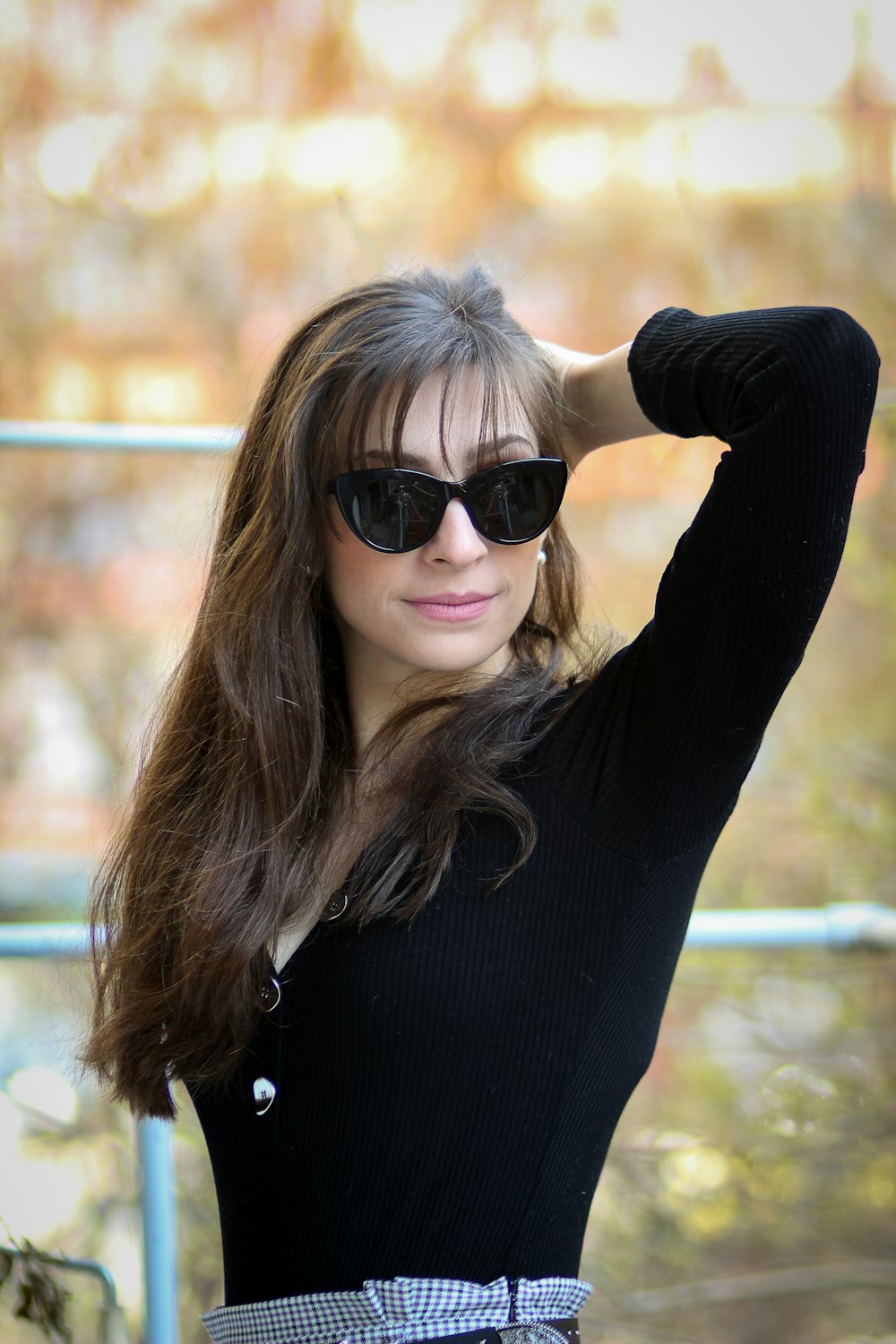 focus photography of woman touching her hair