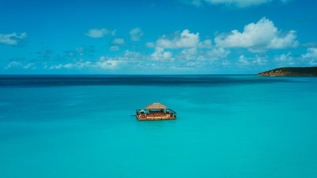 floating house in the middle of sea at daytime