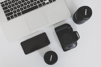 Photo shoot capturing social media content creation with cameras and laptops in use.