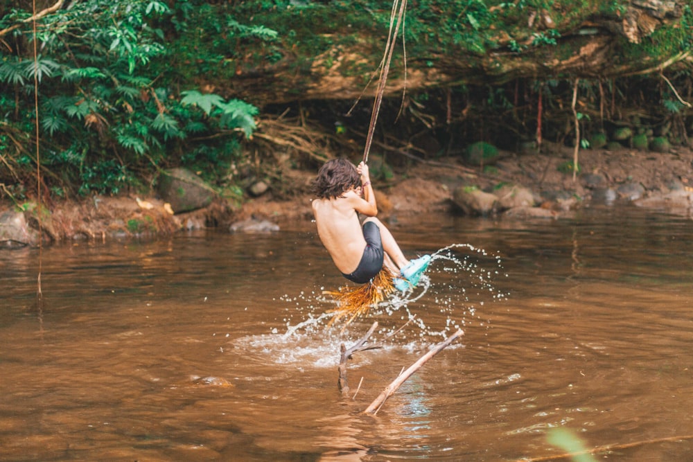 toddler swing over body of water