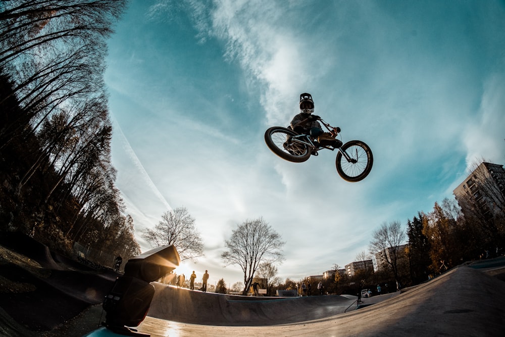 low-angle photography of person riding on motorcycle