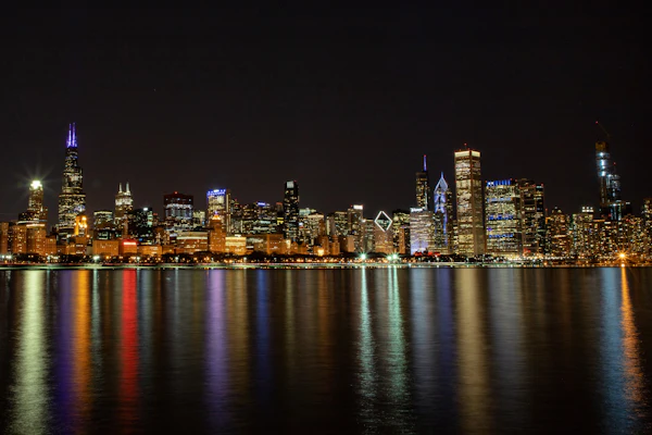 The Chicago skyline at night over Lake Michigan