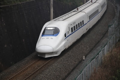 Close-up of the bullet train’s aerodynamic front design gleaming in sunlight