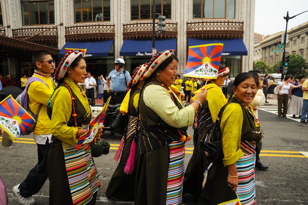 group of women walking on street during daytime