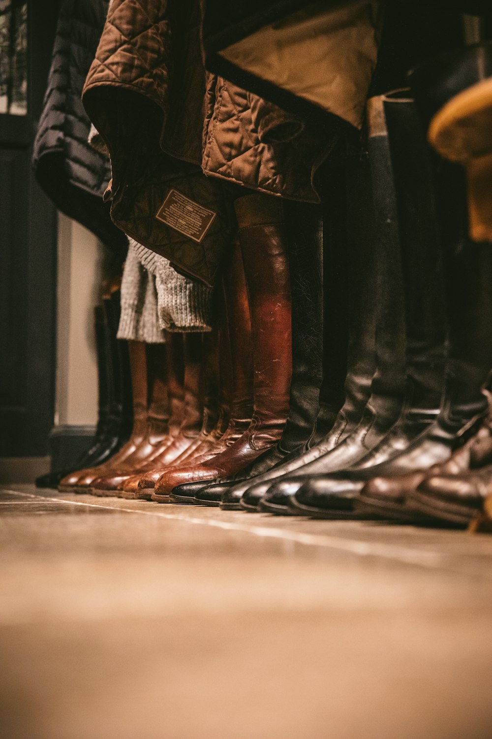 pair of black and brown leather high boots