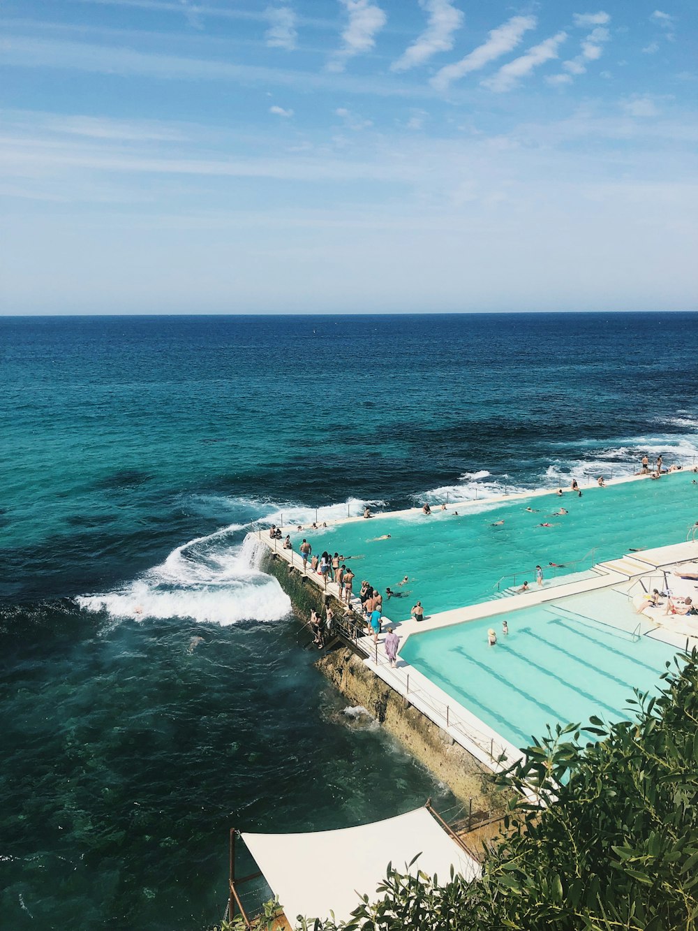 aerial view photography of pool beside ocean