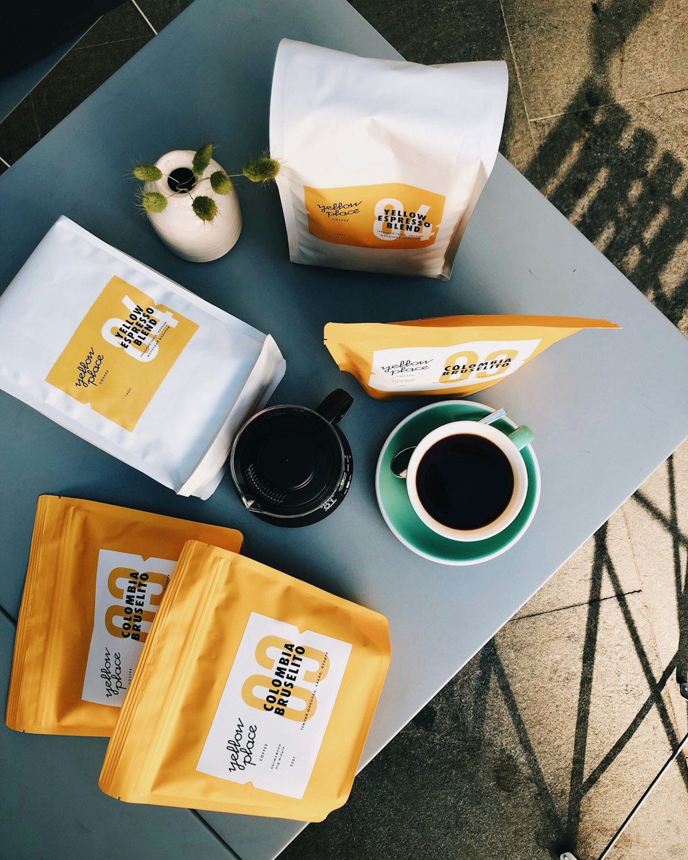 teacups and plastic packs on table