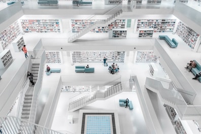 photo of white concrete building interior