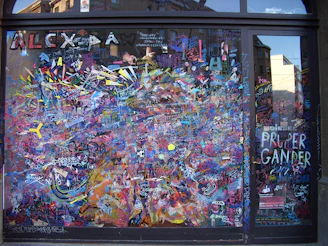 Colorful vinyl-cut decals arranged artistically on a glass surface
