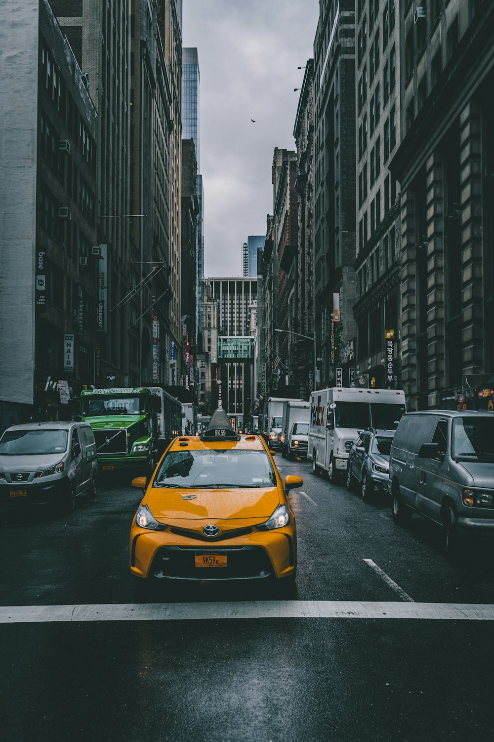 selective color photo of yellow cab